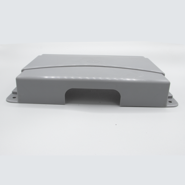 Gray plastic wall plate with opening.