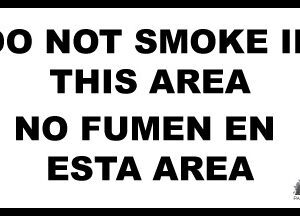 No smoking sign in English and Spanish.