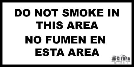 No smoking sign in English and Spanish.