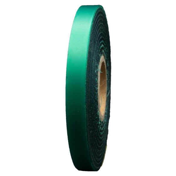 Green satin ribbon rolled on spool.