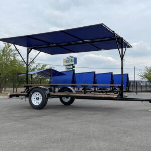 Black trailer with blue canopy and benches.