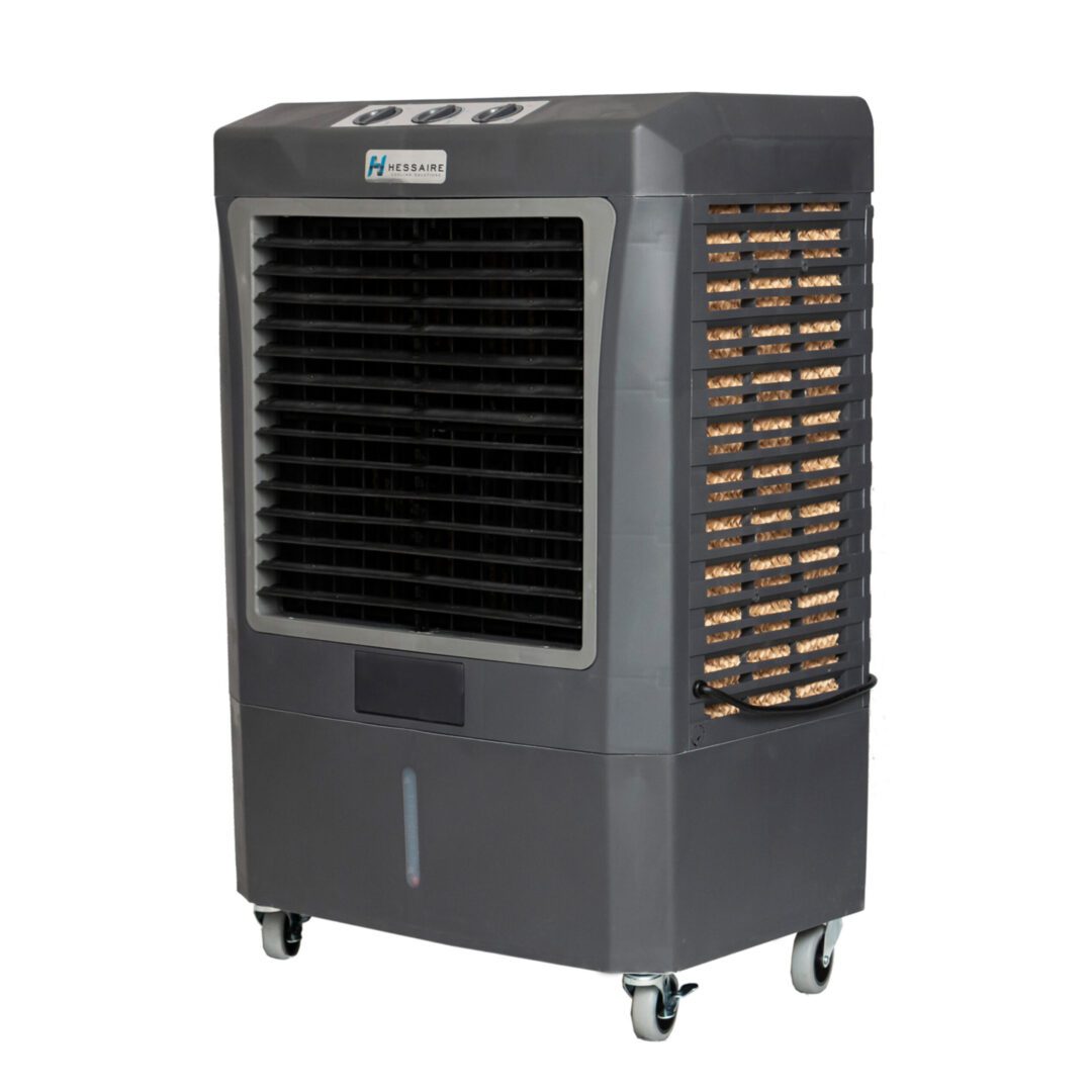 Evaporative cooler on wheels with a fan.