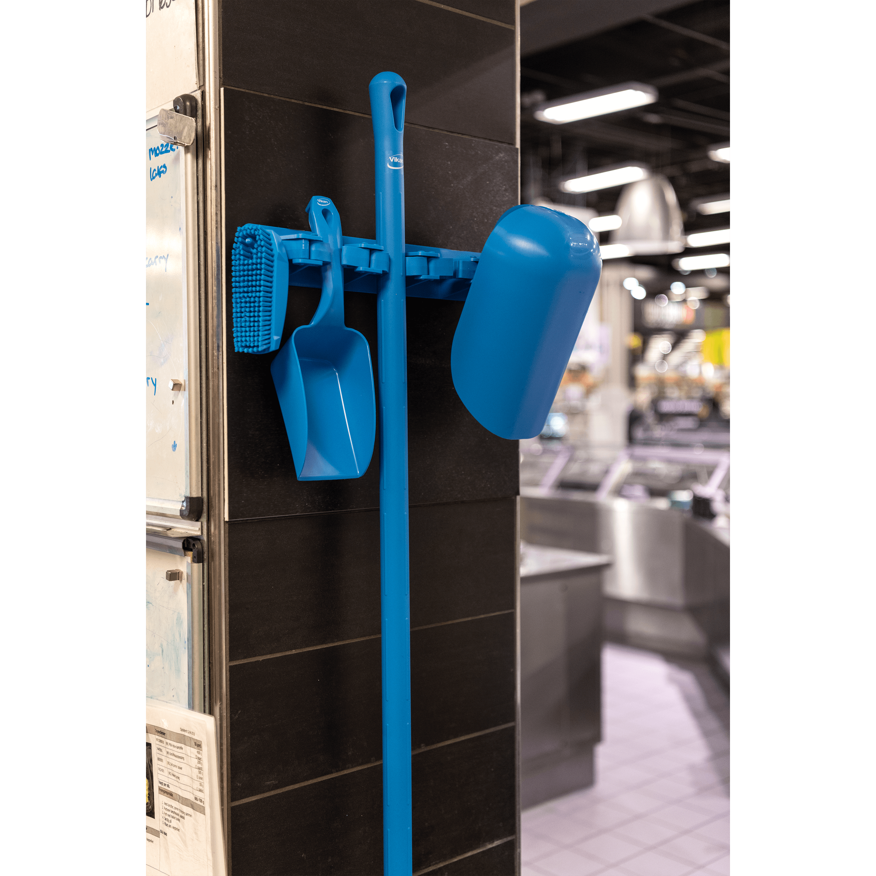 29623-3 Blue cleaning tools hanging on wall.