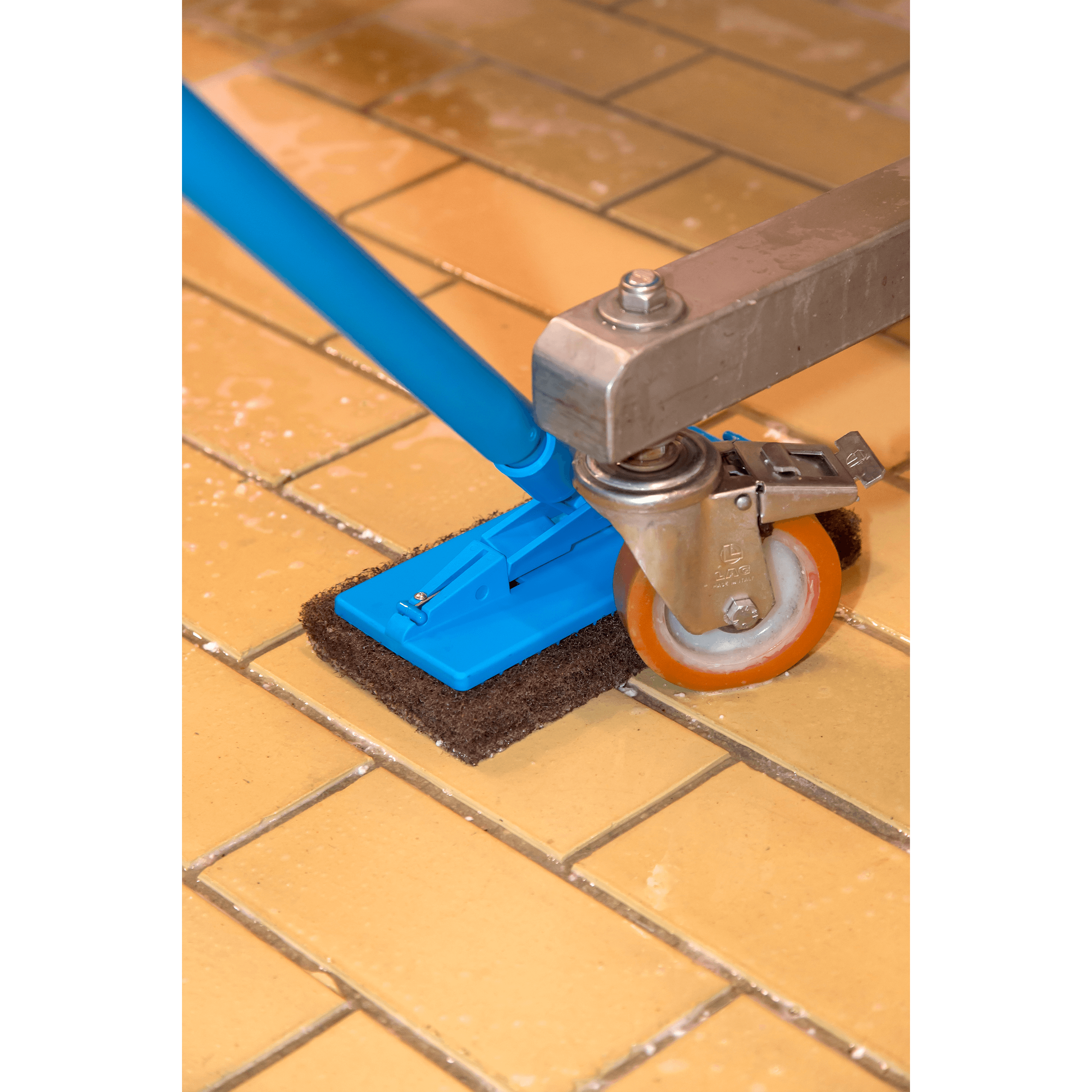 Scrub brush cleaning tiled floor.