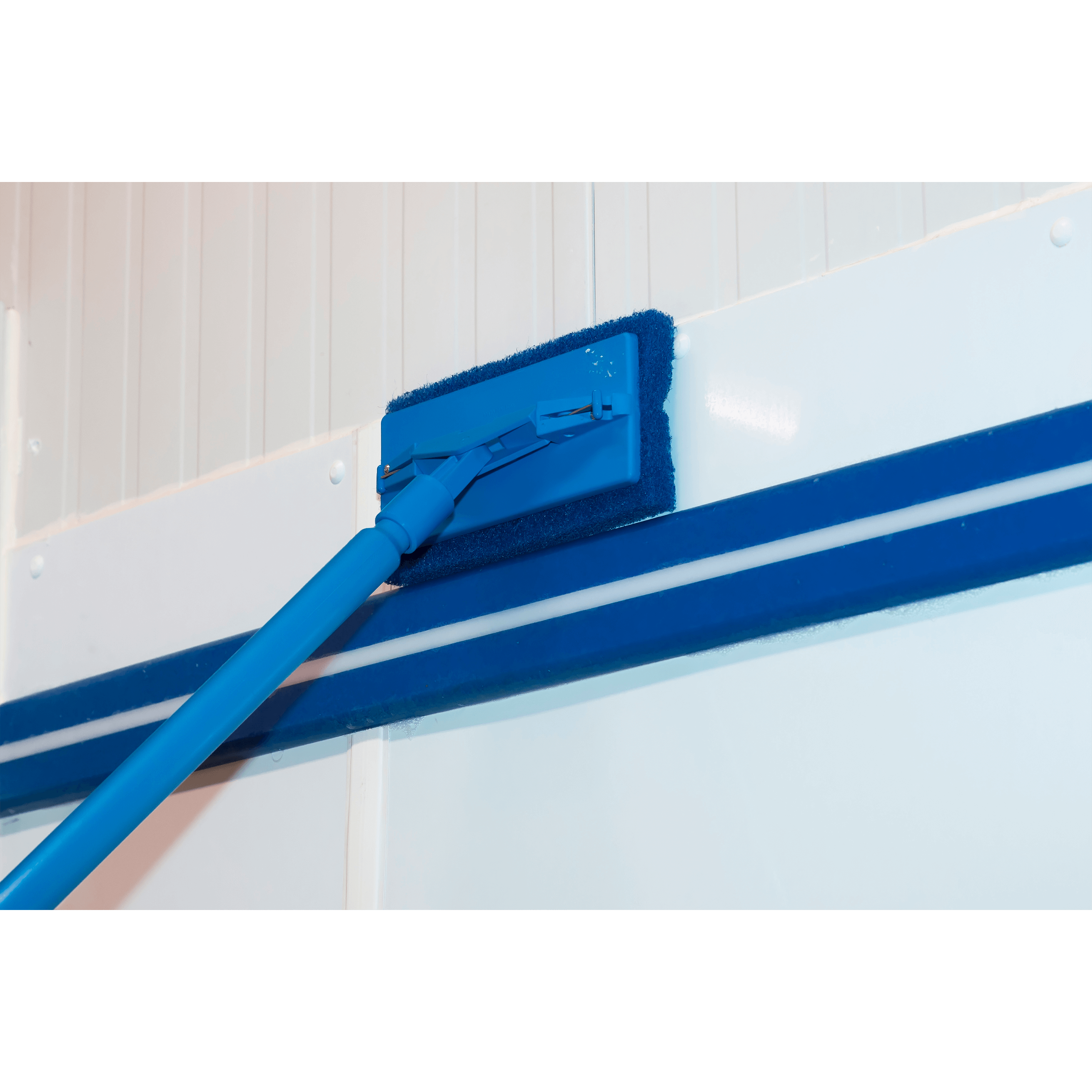 Blue cleaning tool cleans surface.