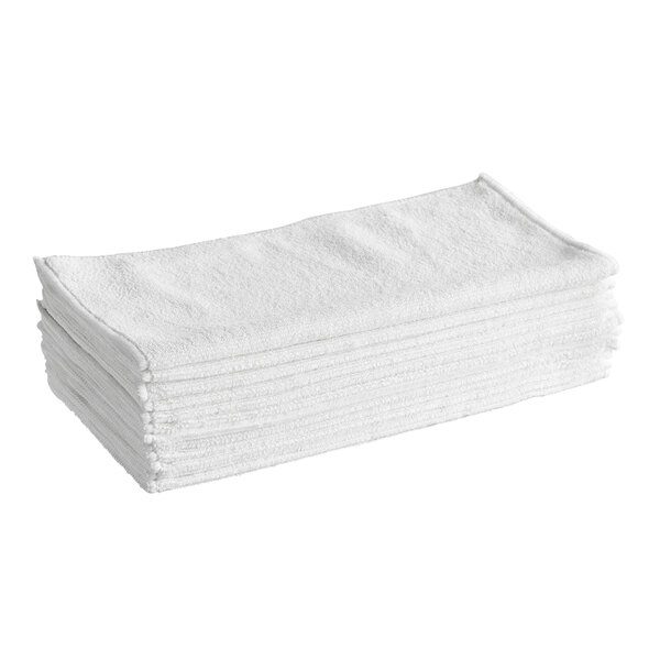 Stack of white microfiber cleaning cloths.