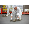 Worker sweeping a warehouse floor.