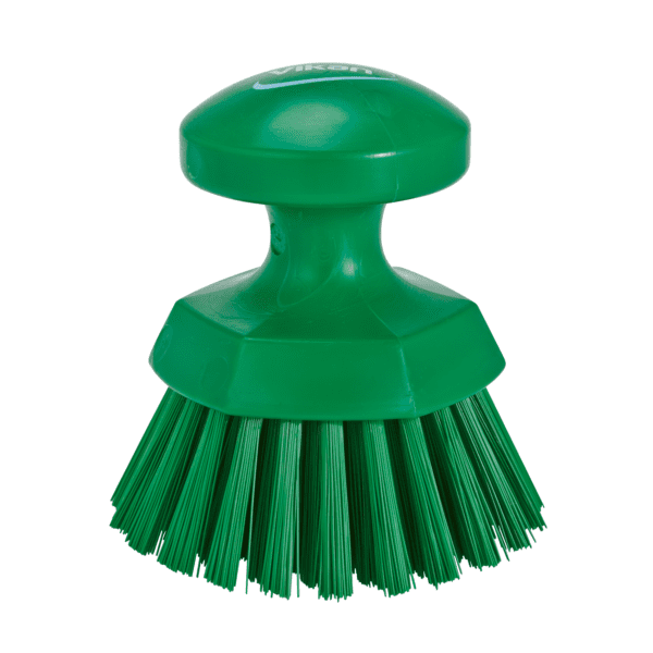 Green plastic scrub brush with handle.