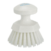 White plastic scrub brush with handle.