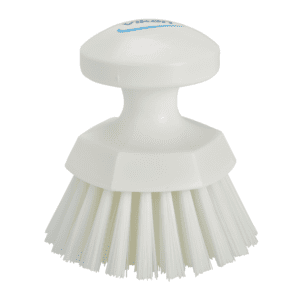 White plastic scrub brush with handle.