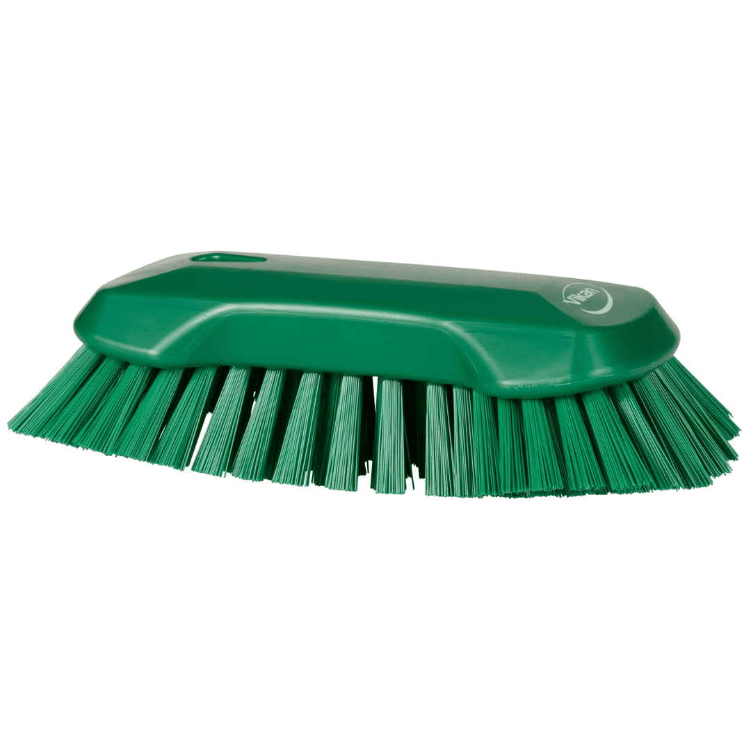 Green cleaning brush with stiff bristles.