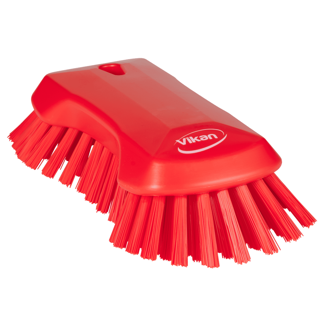 Red cleaning brush with stiff bristles.
