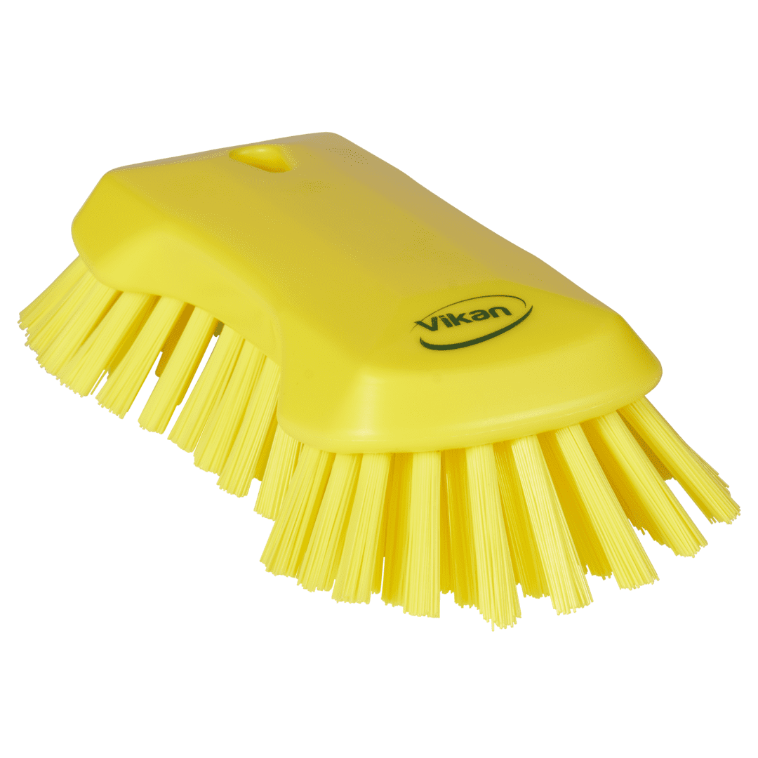 Yellow cleaning brush with soft bristles.