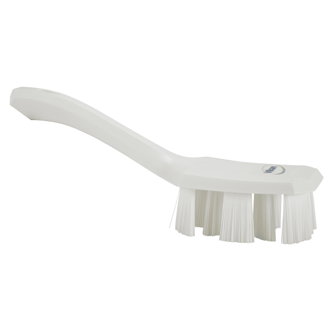 White cleaning brush with stiff bristles.