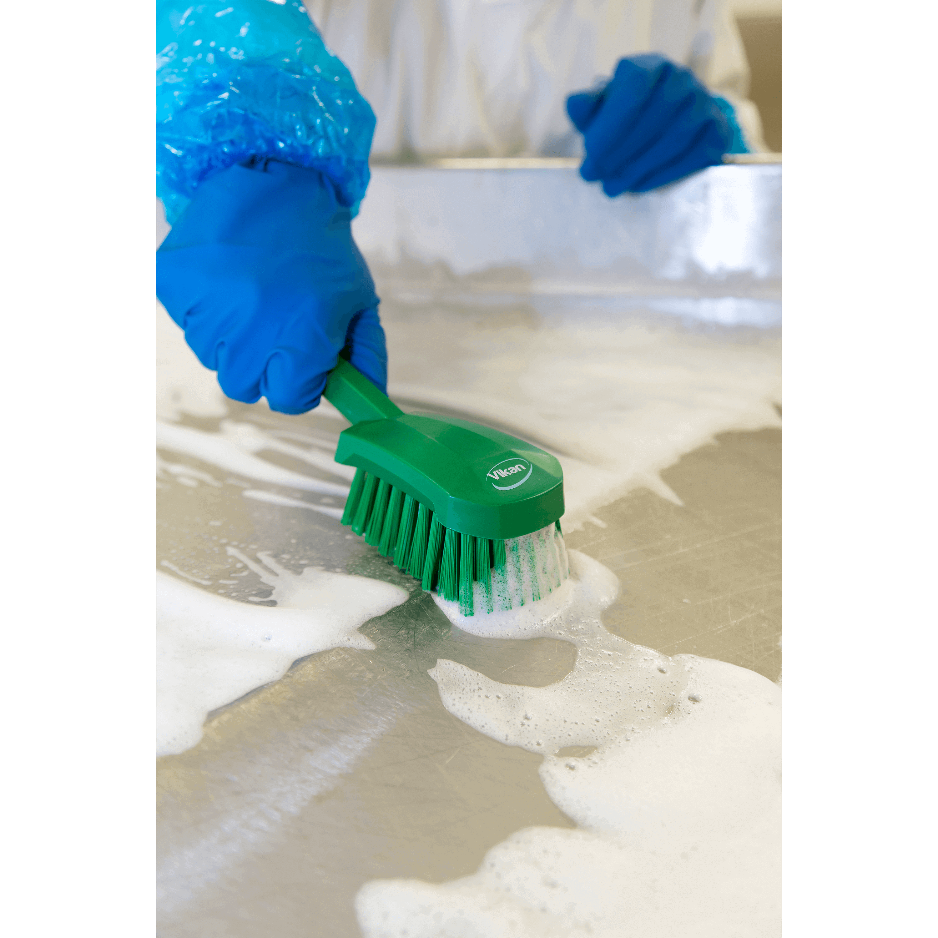 41922-3 Scrubbing a surface with soapy water.